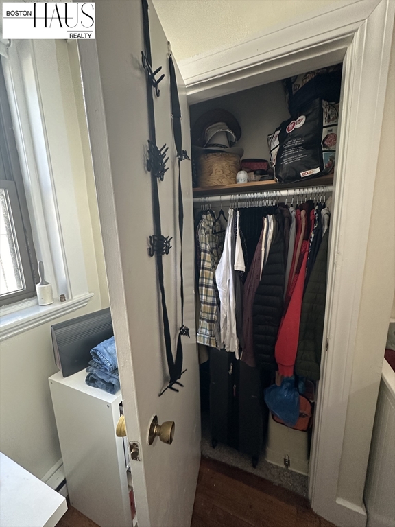 505 Beacon Street, Unit 12 Boston, MA 02215 - Photo 3 of 5 a view of walk in closet with clothes and shoes