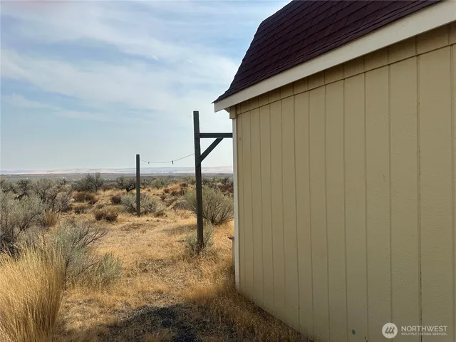a view of a backyard of the house