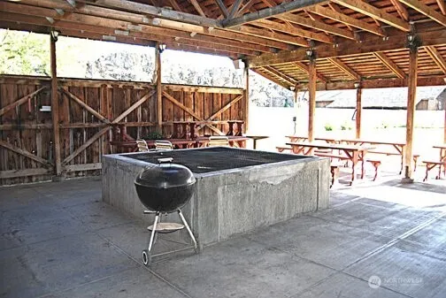 a view of a chairs and table in the patio