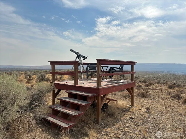 a view of a balcony with chairs