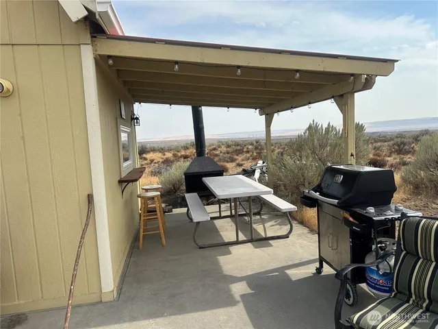 a patio with table and chairs