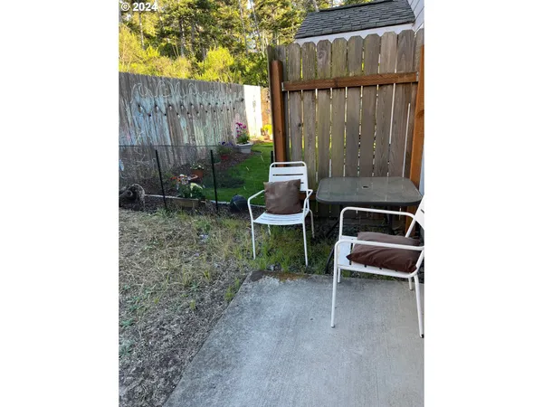 a car parked in front of a white building