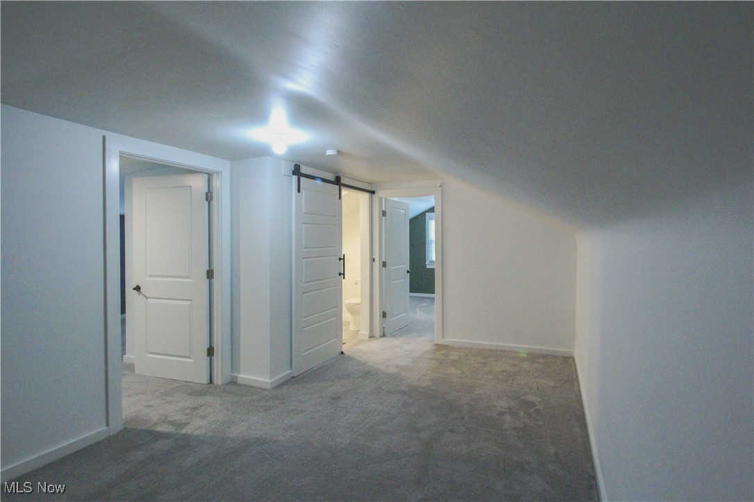 207 Harmon Road Aurora, OH 44202 - Photo 29 of 40 Additional living loft space with access to Bedroom #2 to the left, full bath in the middle and access to Bedroom #3 beyond.