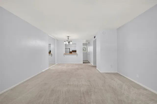 a view of a kitchen with a refrigerator