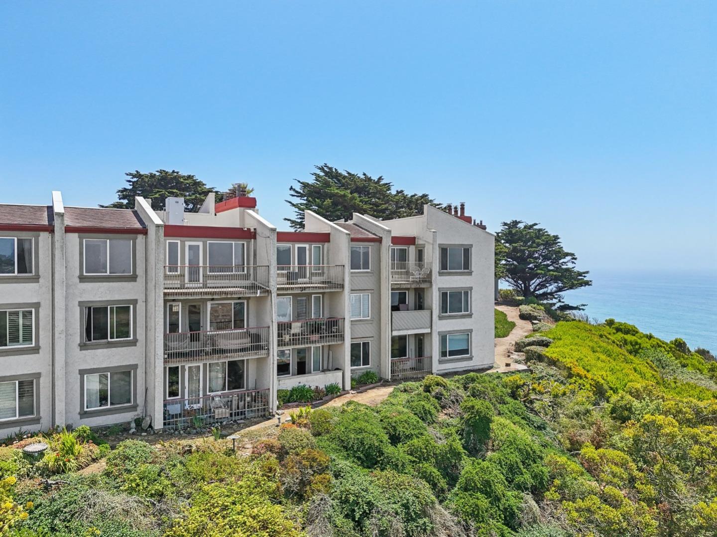 a view of a large building with a yard