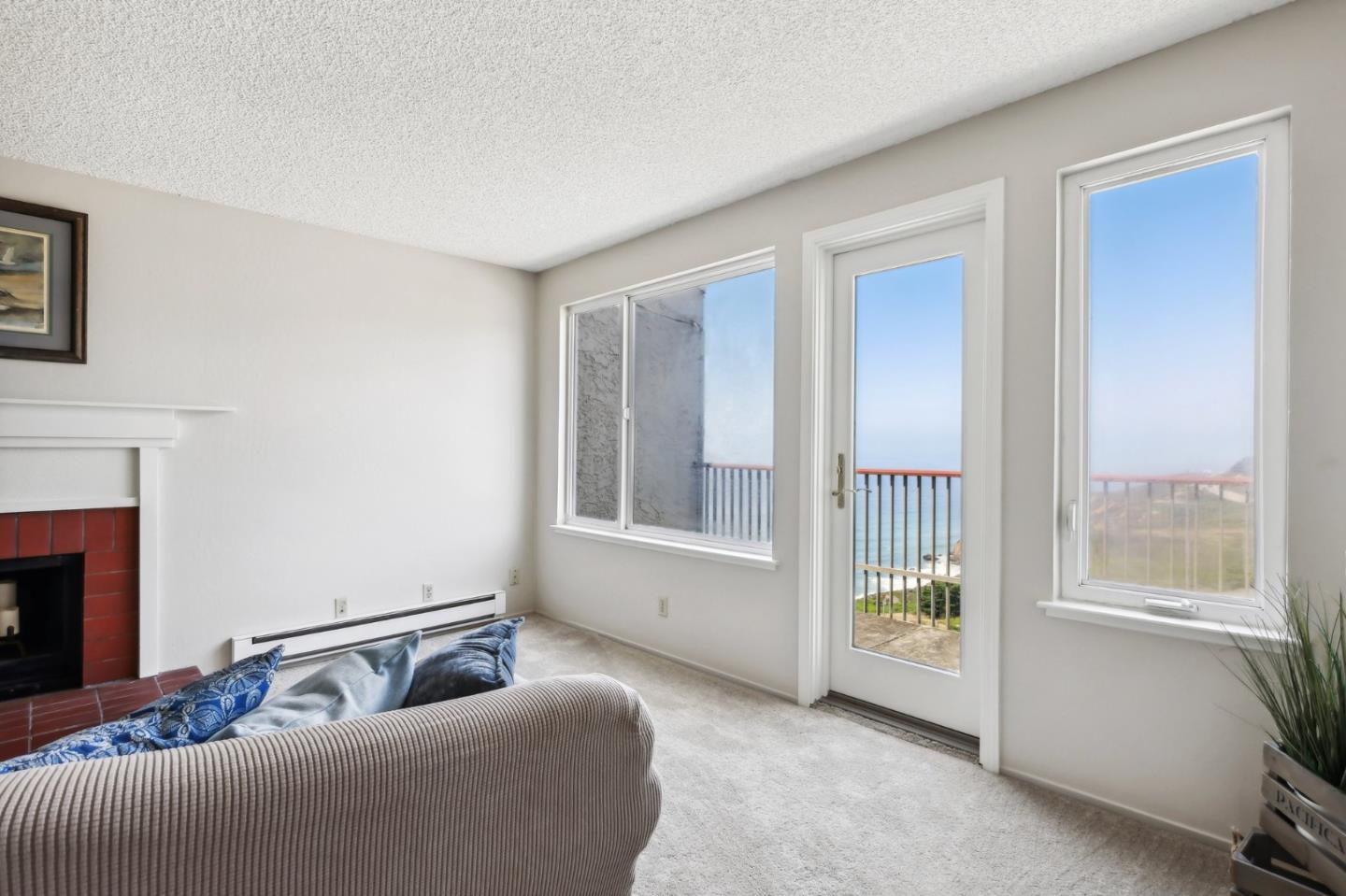 5003 Palmetto Avenue, Unit 89 Pacifica, CA 94044 - Photo 11 of 46 a living room with furniture and a window