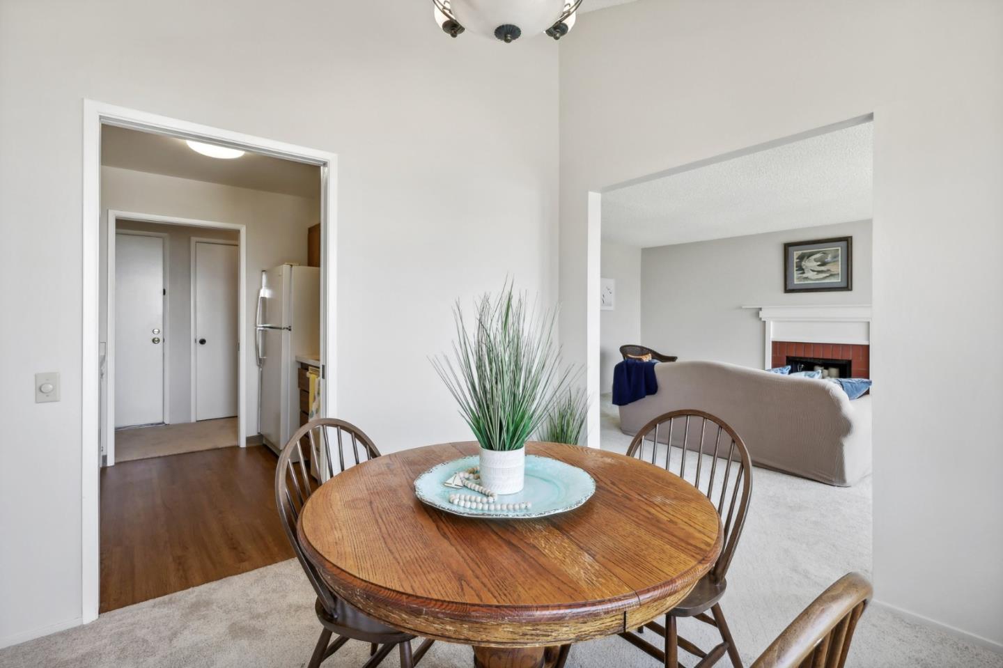 5003 Palmetto Avenue, Unit 89 Pacifica, CA 94044 - Photo 15 of 46 a view of a dining room with furniture and wooden floor