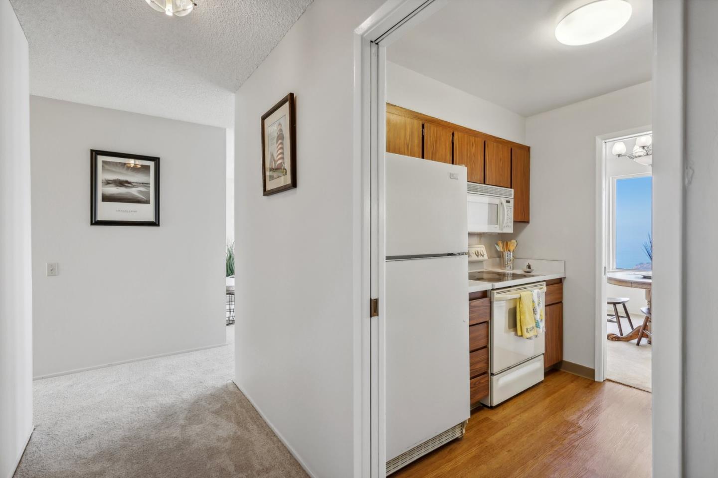 5003 Palmetto Avenue, Unit 89 Pacifica, CA 94044 - Photo 18 of 46 a view of kitchen with stainless steel appliances cabinets and a refrigerator