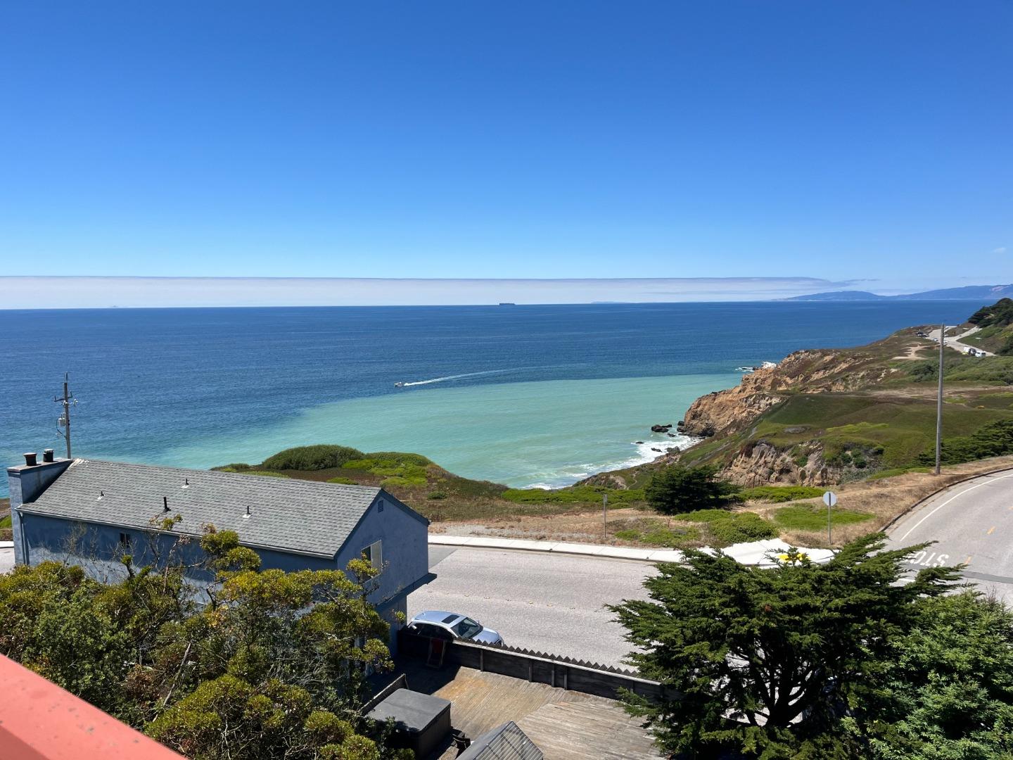 5003 Palmetto Avenue, Unit 89 Pacifica, CA 94044 - Photo 2 of 46 a view of a sky from a terrace