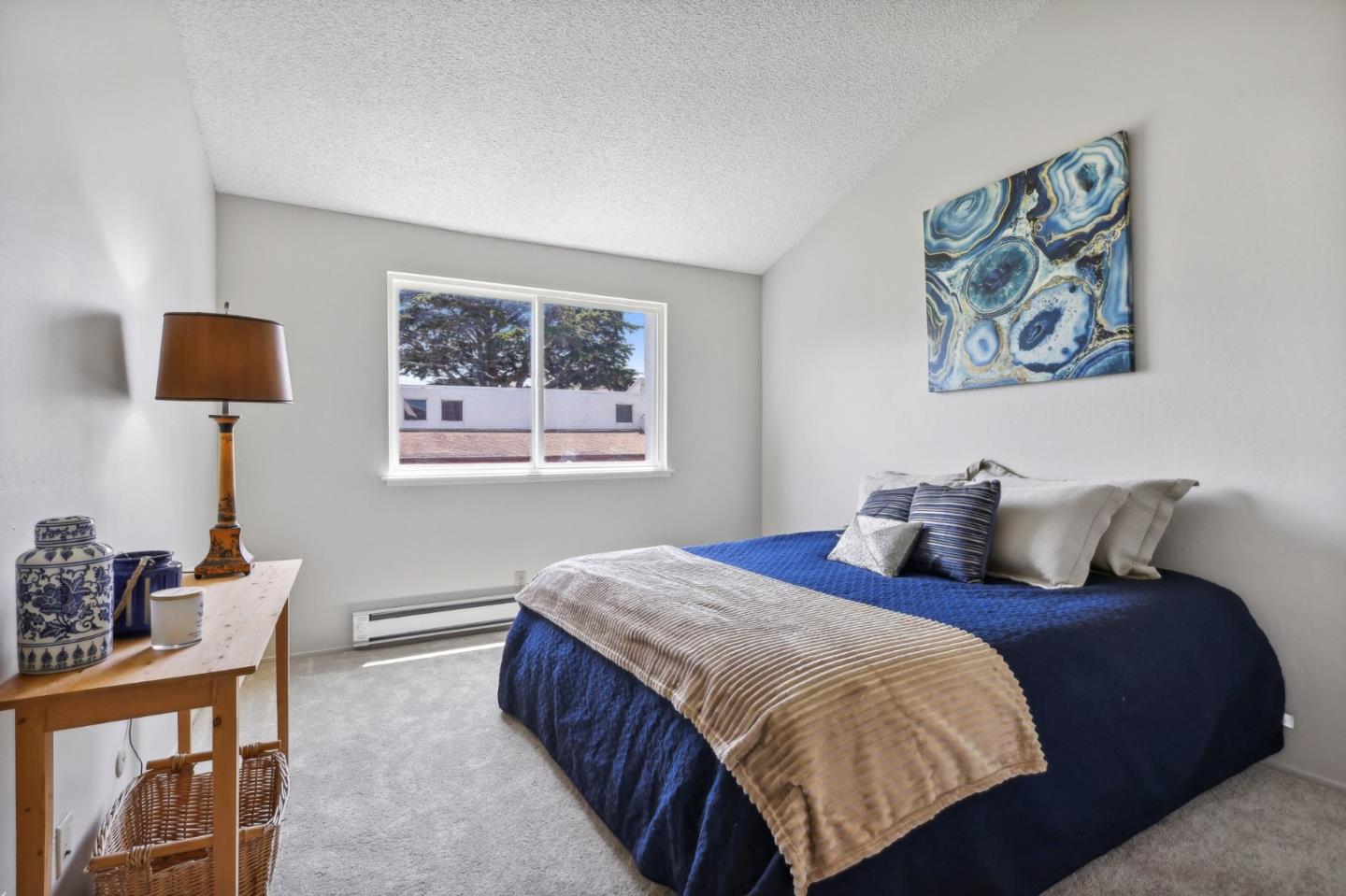 5003 Palmetto Avenue, Unit 89 Pacifica, CA 94044 - Photo 21 of 46 a bedroom with bed and a window