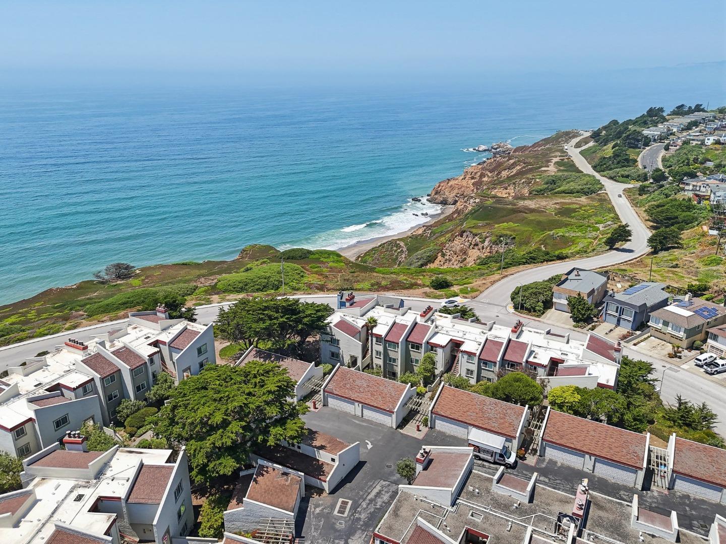 5003 Palmetto Avenue, Unit 89 Pacifica, CA 94044 - Photo 33 of 46 a view of a lake with a table and chairs