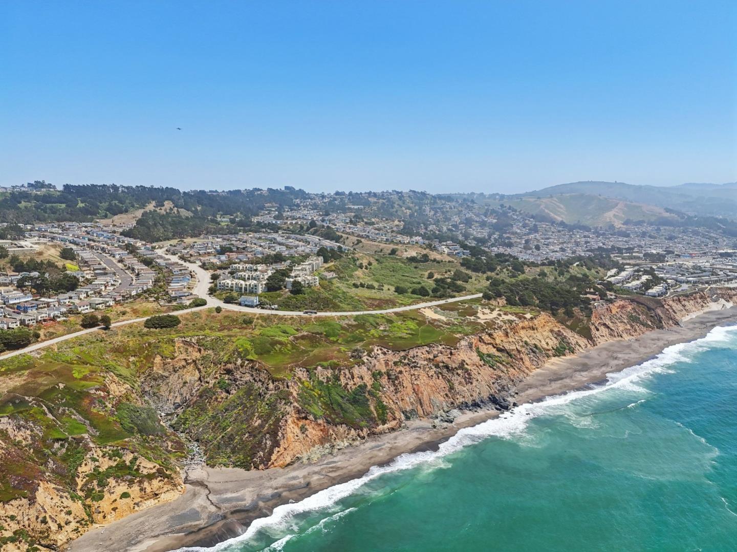 5003 Palmetto Avenue, Unit 89 Pacifica, CA 94044 - Photo 37 of 46 a view of a town with mountains in the background