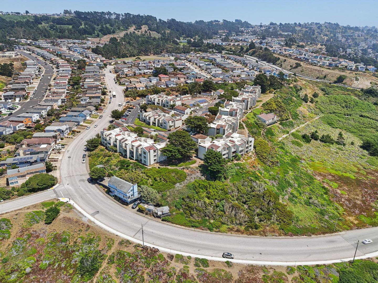 5003 Palmetto Avenue, Unit 89 Pacifica, CA 94044 - Photo 41 of 46 an aerial view of residential houses with outdoor space