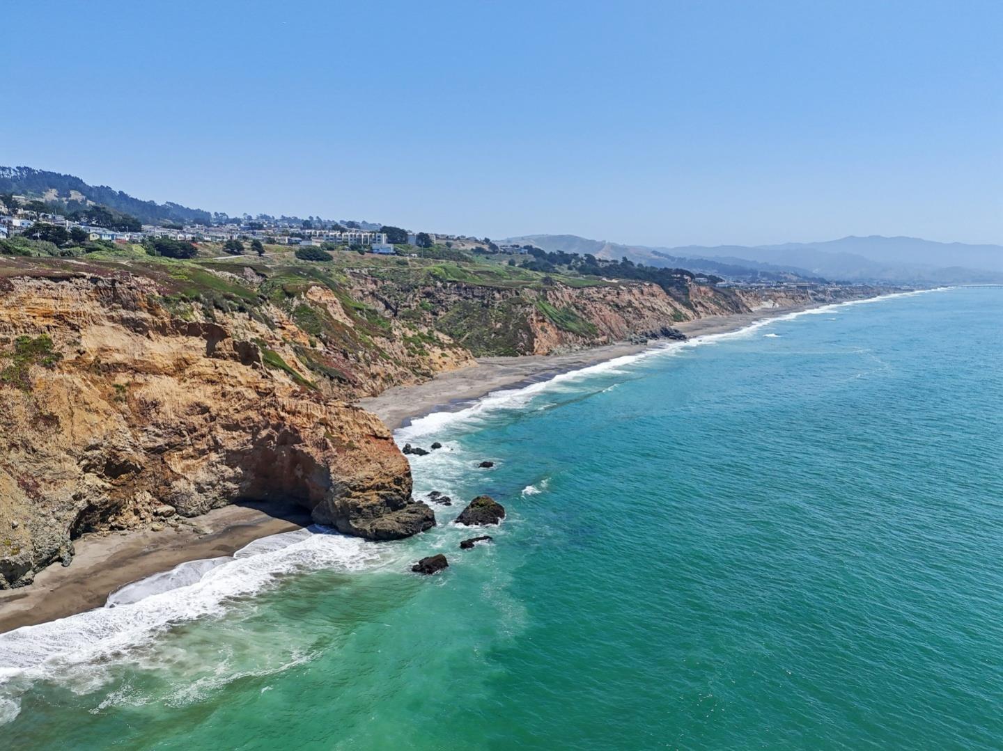5003 Palmetto Avenue, Unit 89 Pacifica, CA 94044 - Photo 45 of 46 a view of a lake with a mountain