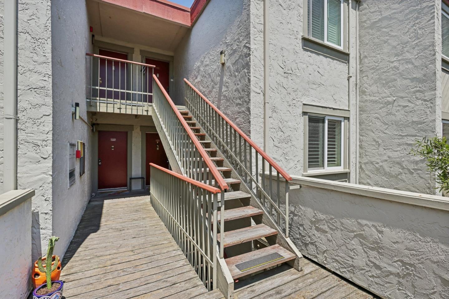 5003 Palmetto Avenue, Unit 89 Pacifica, CA 94044 - Photo 6 of 46 a view of staircase with railing and wooden floor
