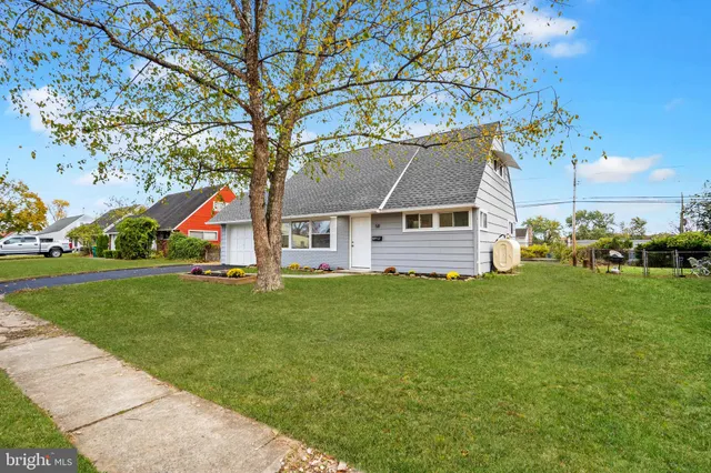 a view of a house with a backyard