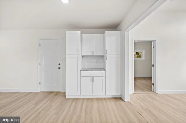 a view of kitchen with wooden floor