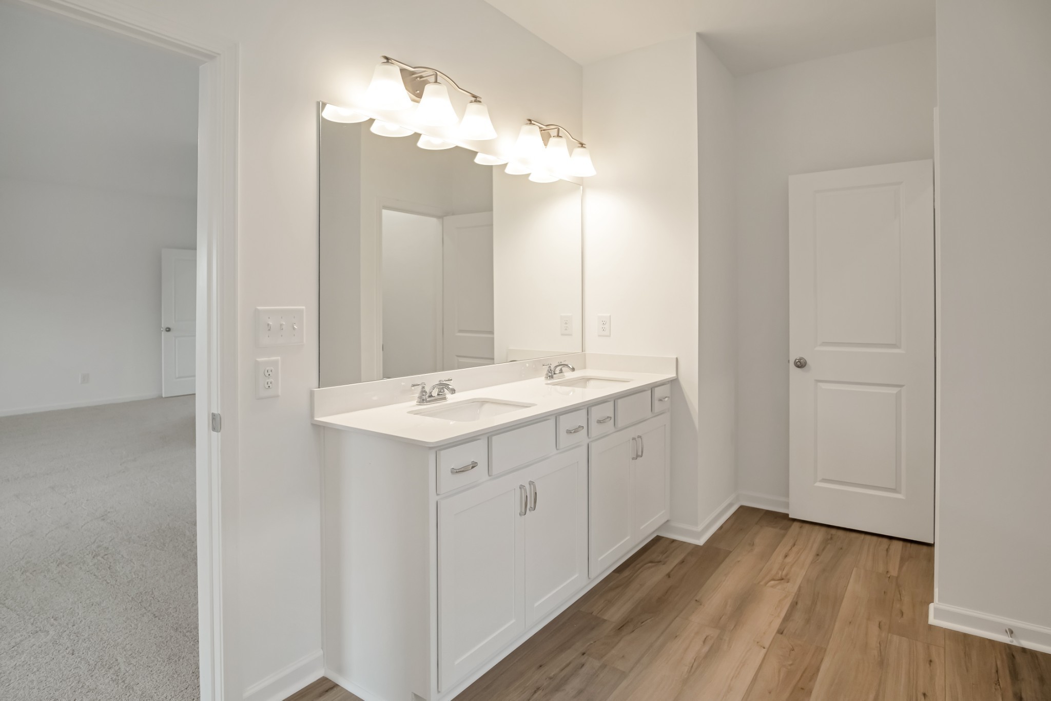 769 Chiswick Court Lebanon, TN 37087 - Photo 30 of 44 a bathroom with a double vanity sink and a mirror