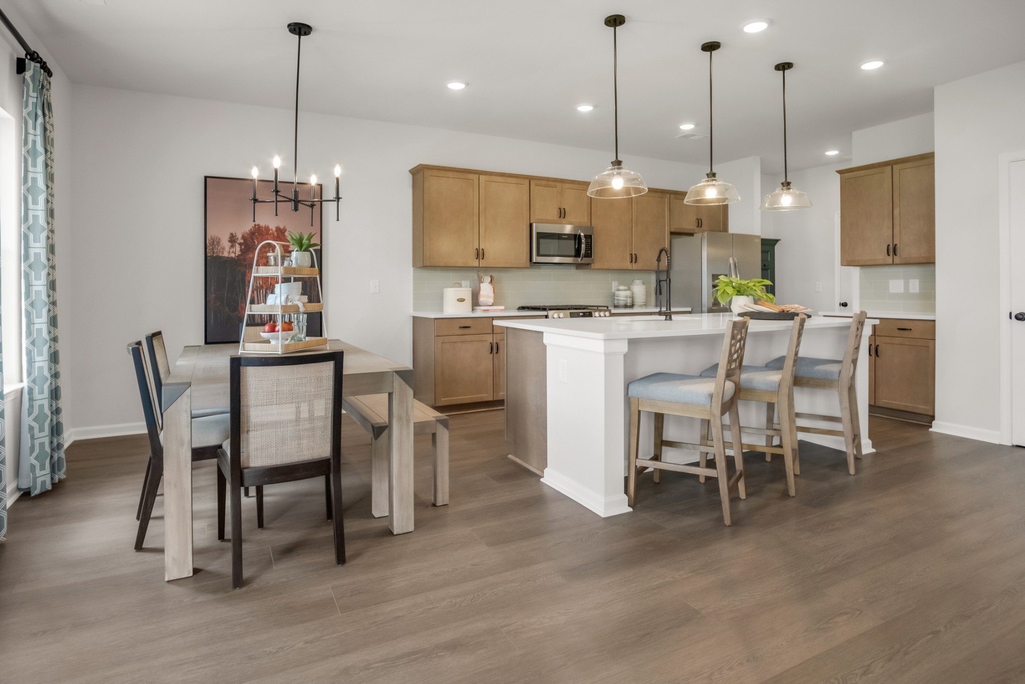 769 Chiswick Court Lebanon, TN 37087 - Photo 37 of 44 a view of a dining room and livingroom with furniture wooden floor a chandelier