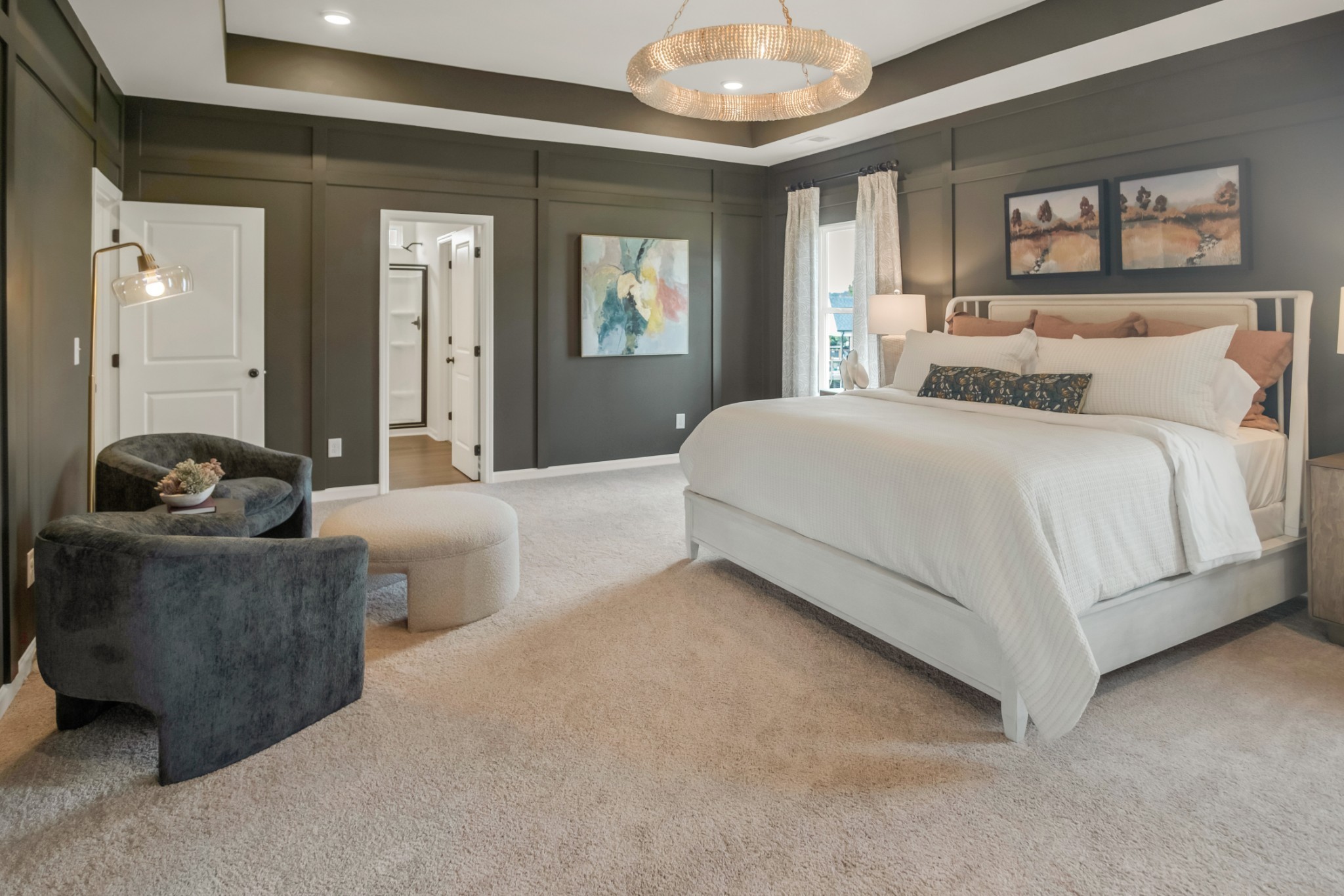 769 Chiswick Court Lebanon, TN 37087 - Photo 42 of 44 a spacious bedroom with a bed and a chandelier