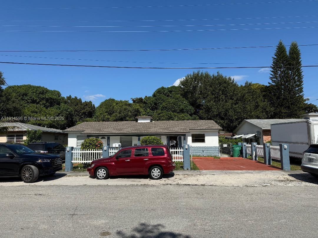 a view of a car parked in front of a house