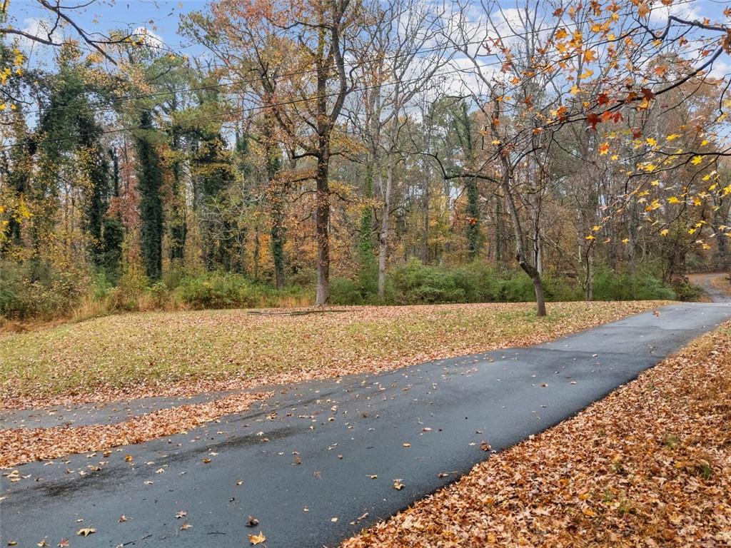 3116 Batesville Road Woodstock, GA 30188 - Photo 7 of 7 a view of a yard with large trees