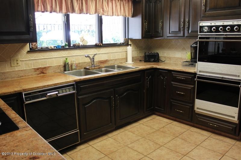 311 Lockville Road Falls, PA 18615 - Photo 6 of 19 a kitchen with a sink stove and microwave