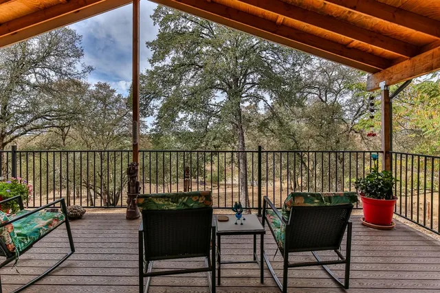 a view of balcony with couch and wooden floor