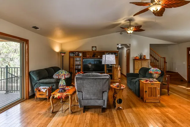 a kitchen with stainless steel appliances a sink a window and cabinets