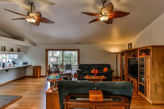 a bathroom with a sink a toilet and shower curtain
