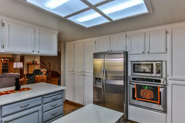 a view of a lake with a tree in the background