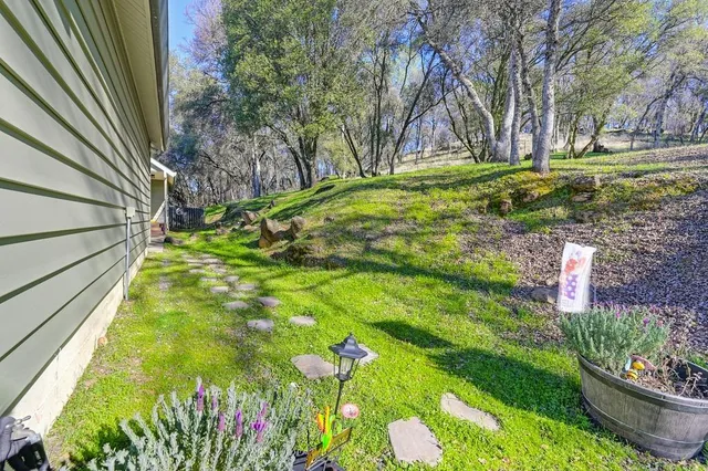 a view of a balcony with wooden fence