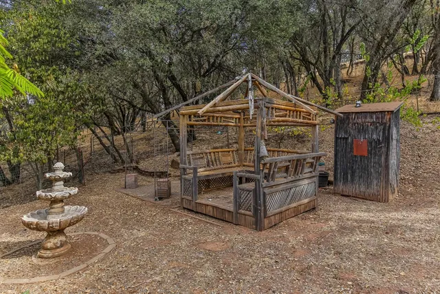 a living room with furniture a ceiling fan and a flat screen tv