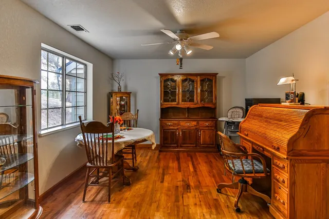 a view of a livingroom with furniture hardwood and windows