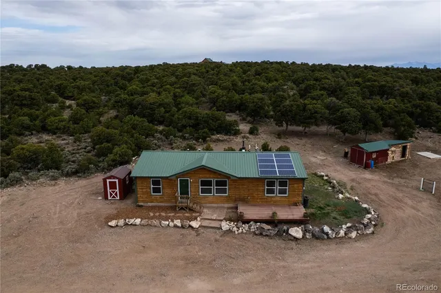 an aerial view of a house with a garden