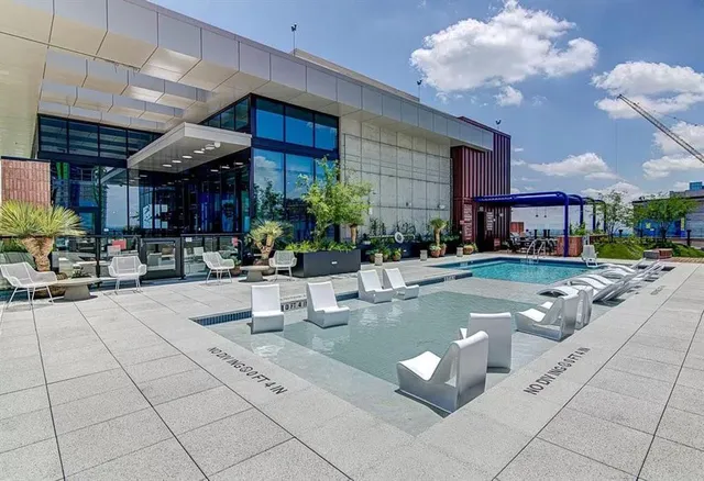 a view of a kitchen with furniture and a potted plant