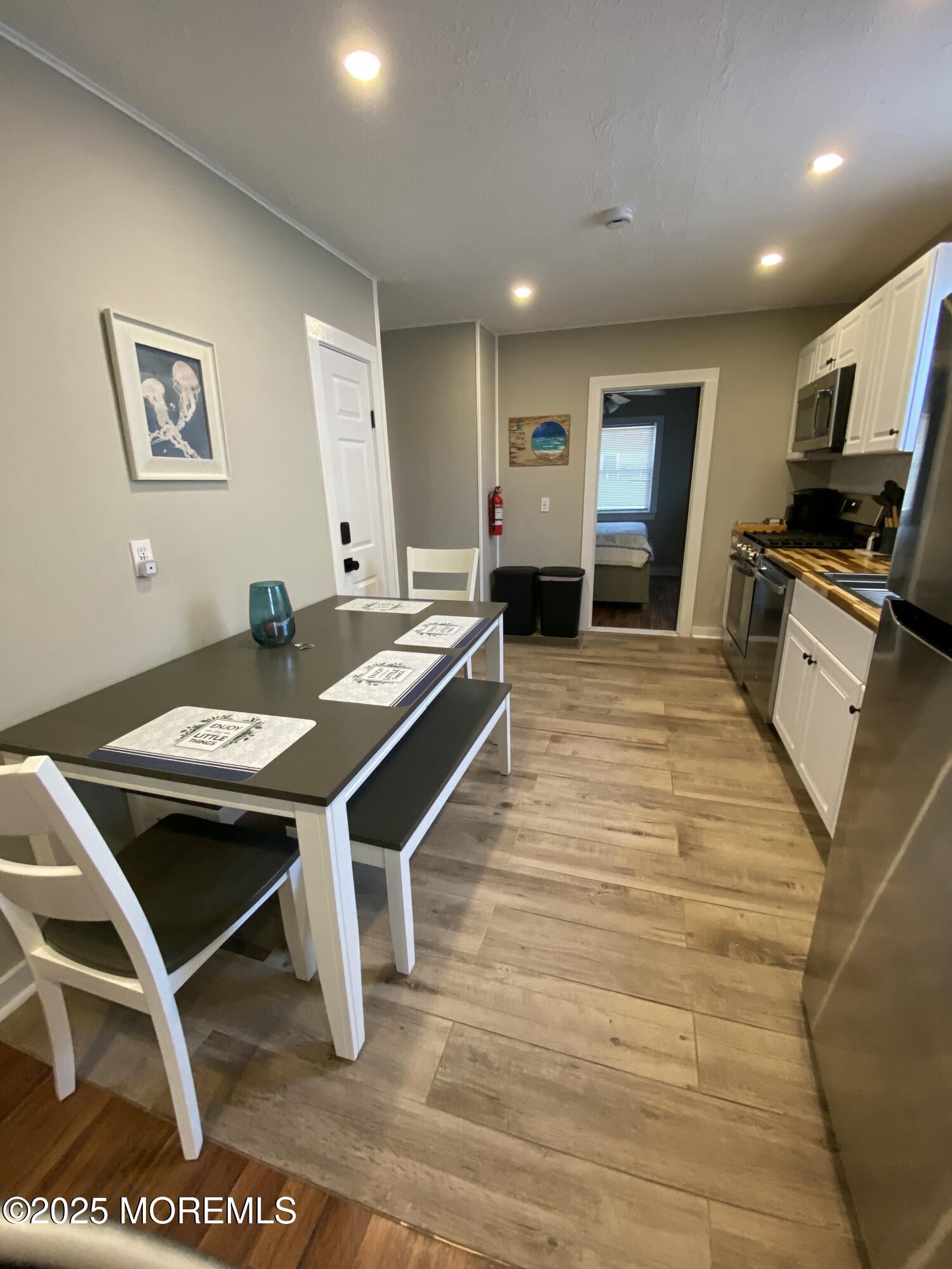 215 Webster Avenue, Unit 1 Seaside Heights, NJ 08751 - Photo 13 of 14 a room with furniture pool table and chairs