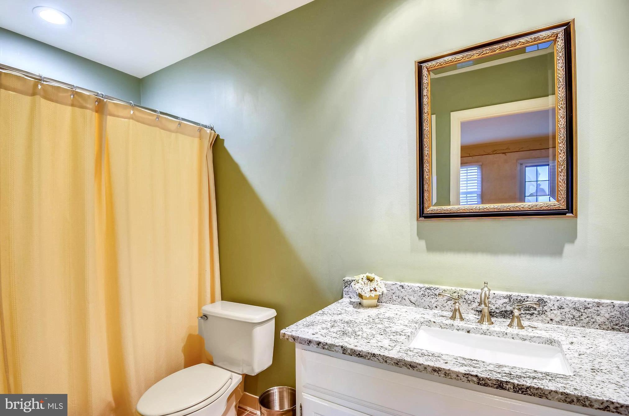 1180 South River Landing Road Edgewater, MD 21037 - Photo 14 of 40 Adjoining Full Bath with Granite-Topped Vanity