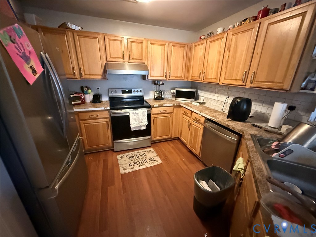 110 Chardonnay Road Williamsburg, VA 23185 - Photo 5 of 11 a kitchen with a sink appliances and cabinets