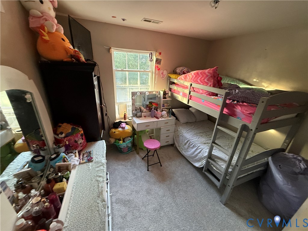 110 Chardonnay Road Williamsburg, VA 23185 - Photo 6 of 11 a bedroom with furniture and a window