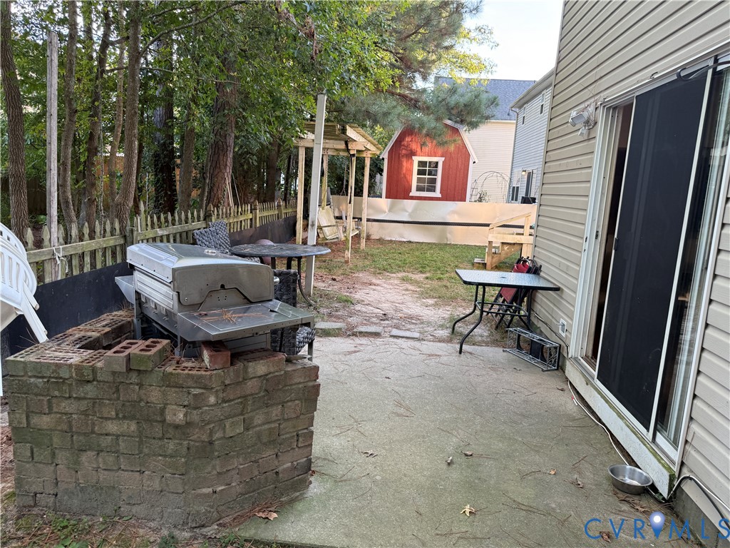 110 Chardonnay Road Williamsburg, VA 23185 - Photo 10 of 11 a view of a house with backyard and sitting area