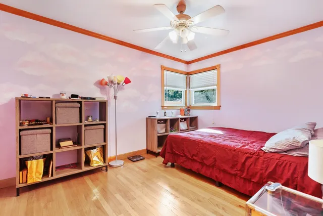 a bedroom with a bed and a book shelf