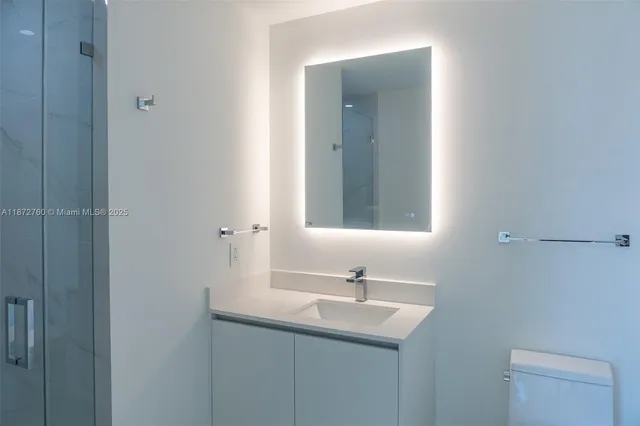 a bedroom with furniture and large windows