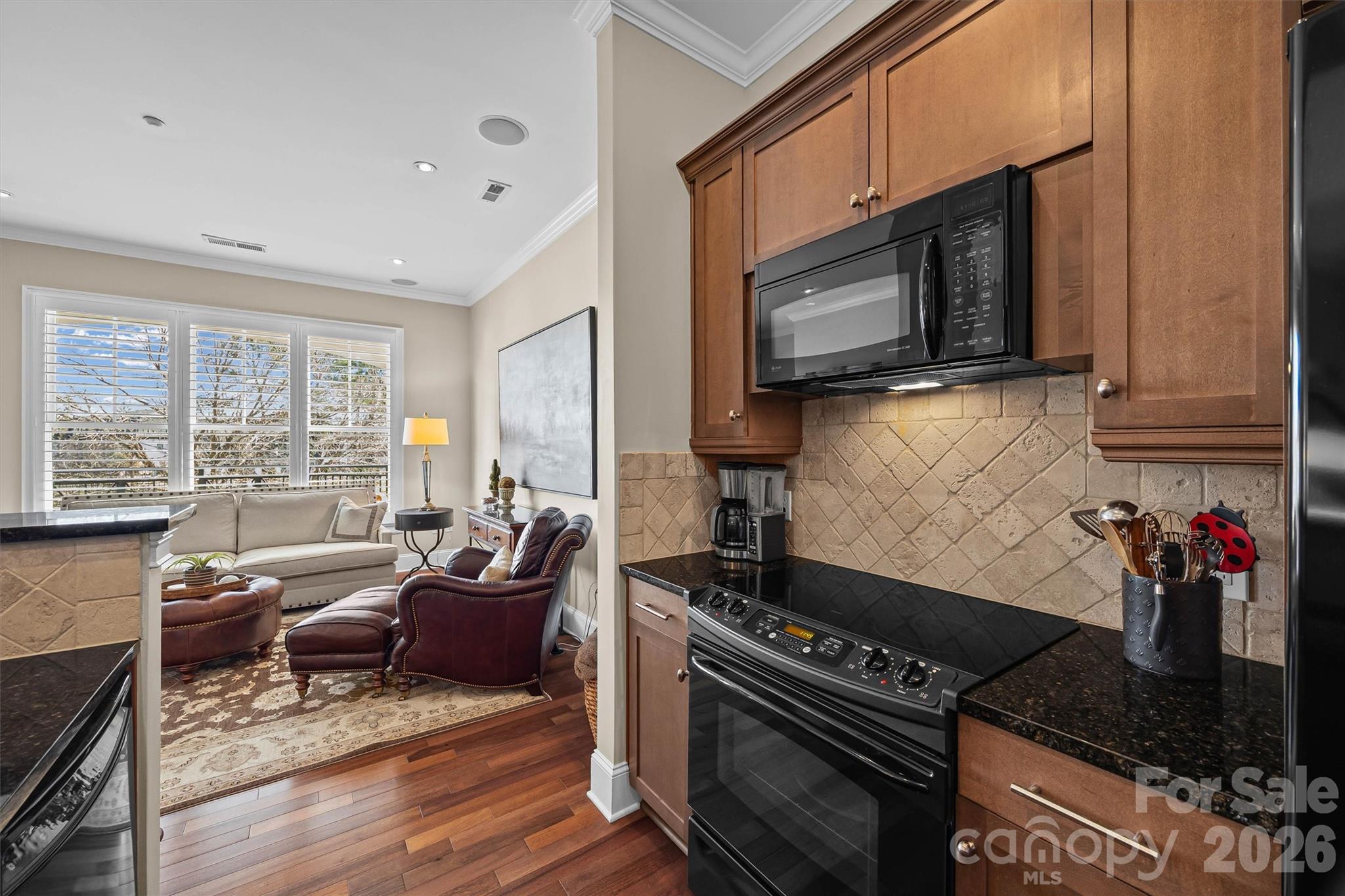 5425 Closeburn Road, Unit 214 Charlotte, NC 28210 - Photo 14 of 25 a kitchen with a stove and a microwave