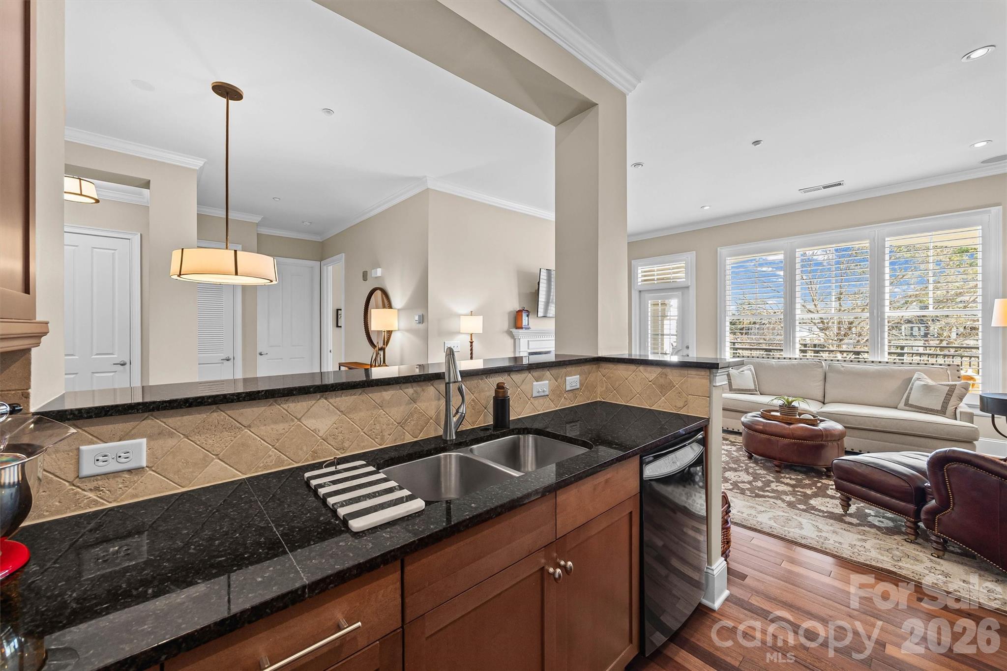 5425 Closeburn Road, Unit 214 Charlotte, NC 28210 - Photo 15 of 25 a kitchen with granite countertop a sink a counter space appliances and cabinets