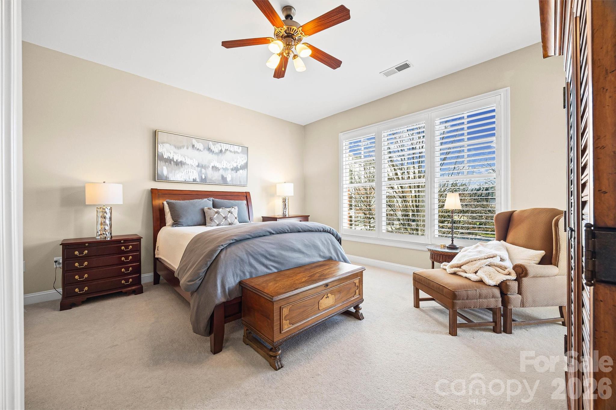 5425 Closeburn Road, Unit 214 Charlotte, NC 28210 - Photo 16 of 25 a spacious bedroom with a bed and a chandelier