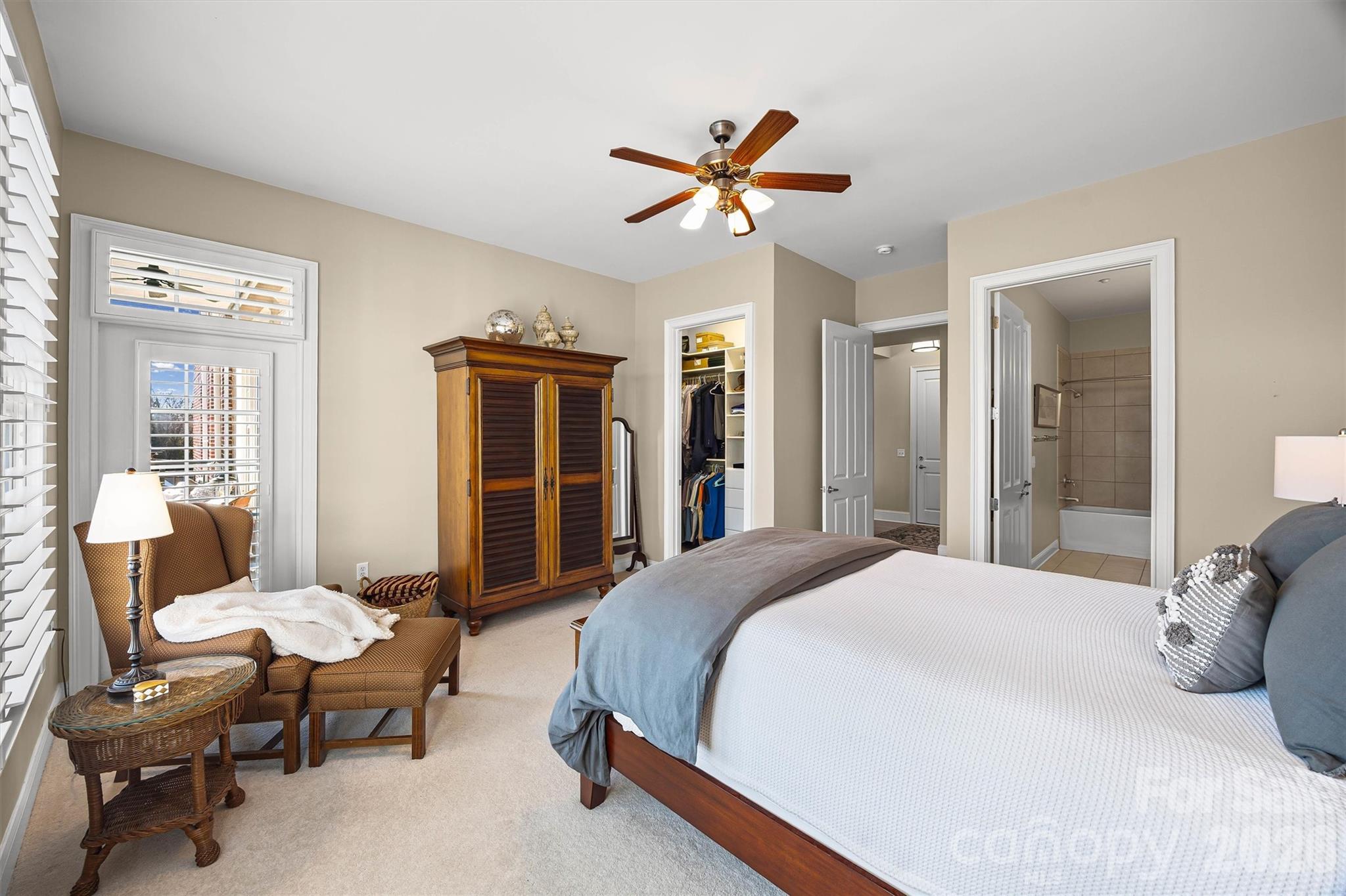 5425 Closeburn Road, Unit 214 Charlotte, NC 28210 - Photo 17 of 25 a spacious bedroom with a bed and a chandelier