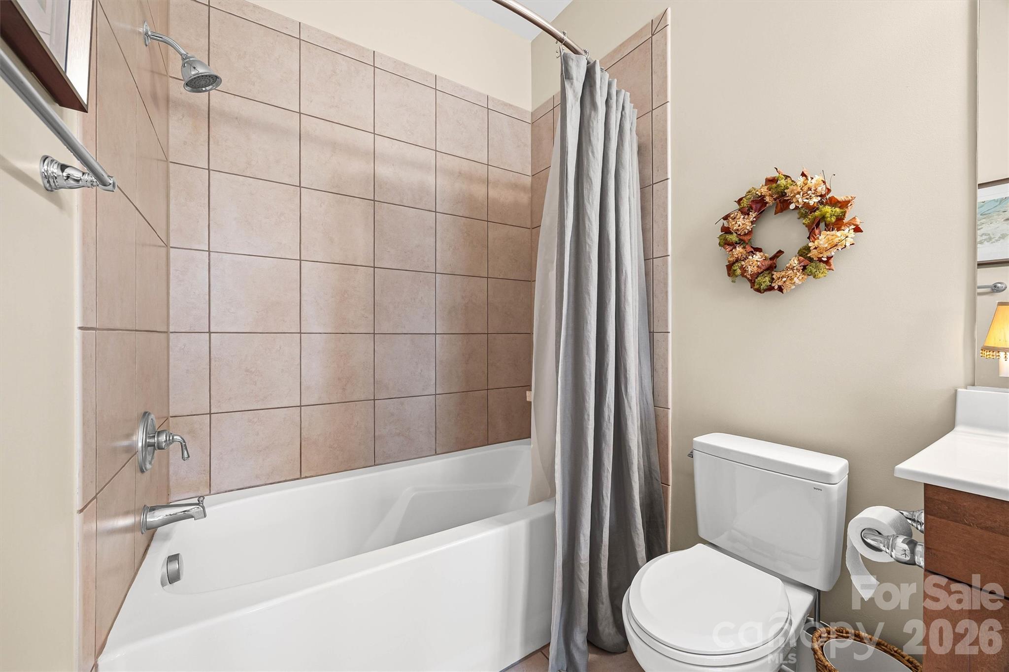 5425 Closeburn Road, Unit 214 Charlotte, NC 28210 - Photo 19 of 25 a white toilet sitting next to a bath tub