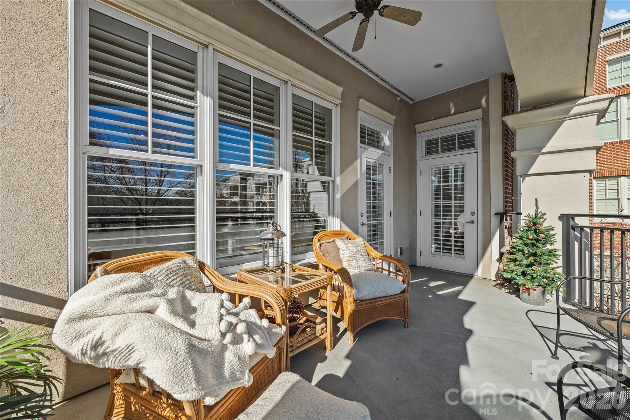 5425 Closeburn Road, Unit 214 Charlotte, NC 28210 - Photo 22 of 25 a bed sitting in a balcony next to a window