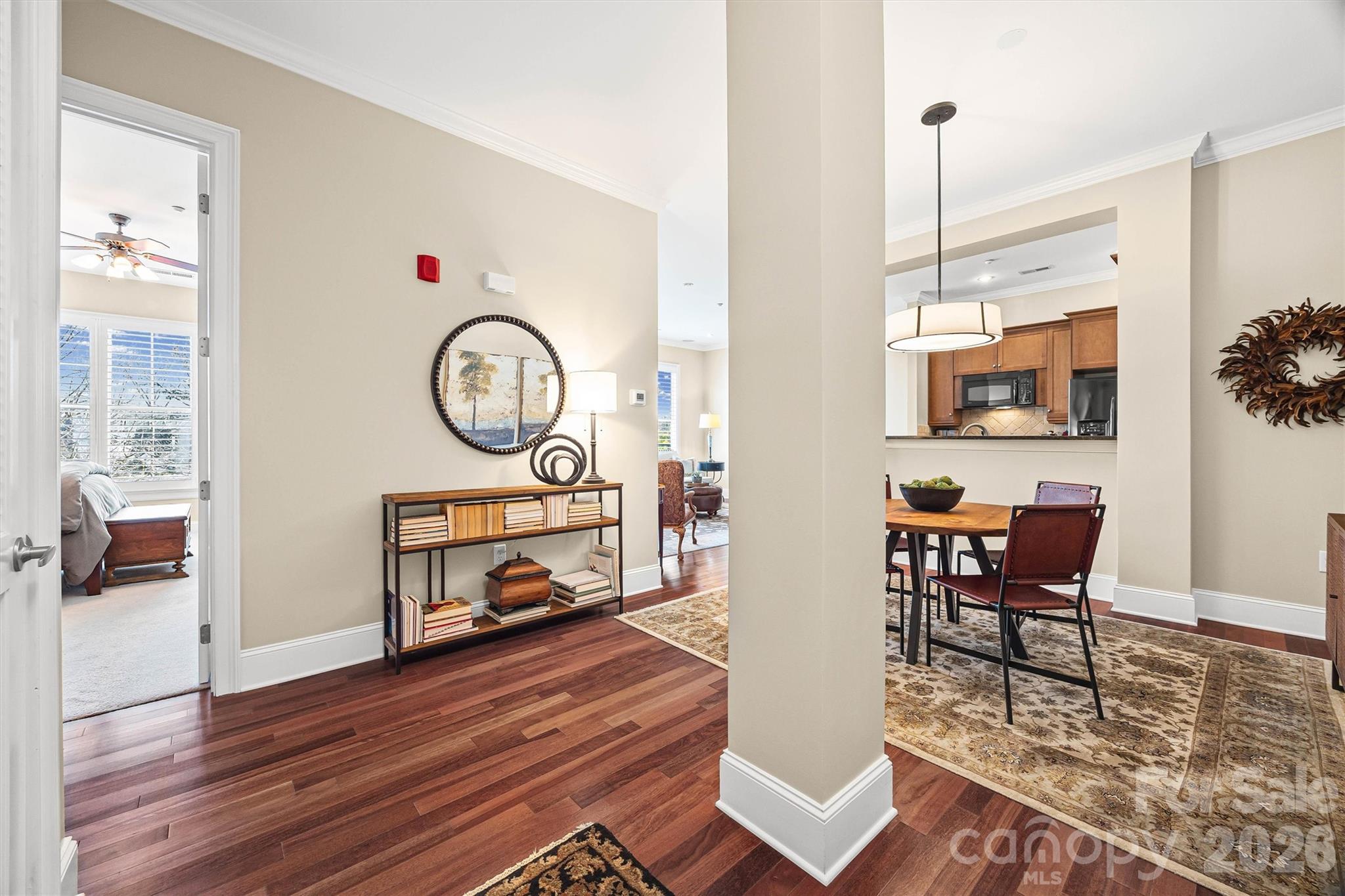 5425 Closeburn Road, Unit 214 Charlotte, NC 28210 - Photo 4 of 25 a living room with furniture a rug and a large window